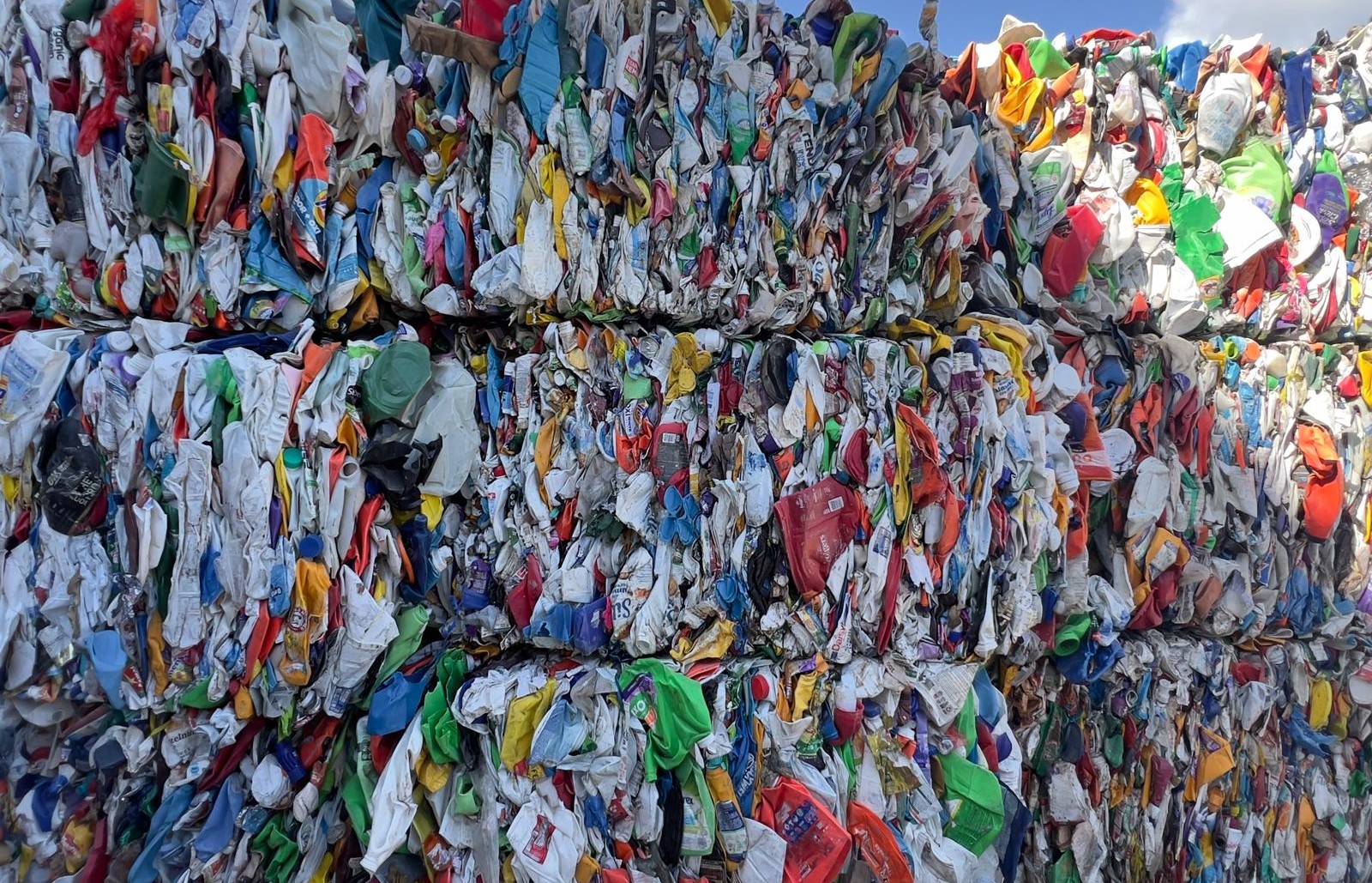 Stacked color HDPE bales from post-consumer detergent and cleaning product containers