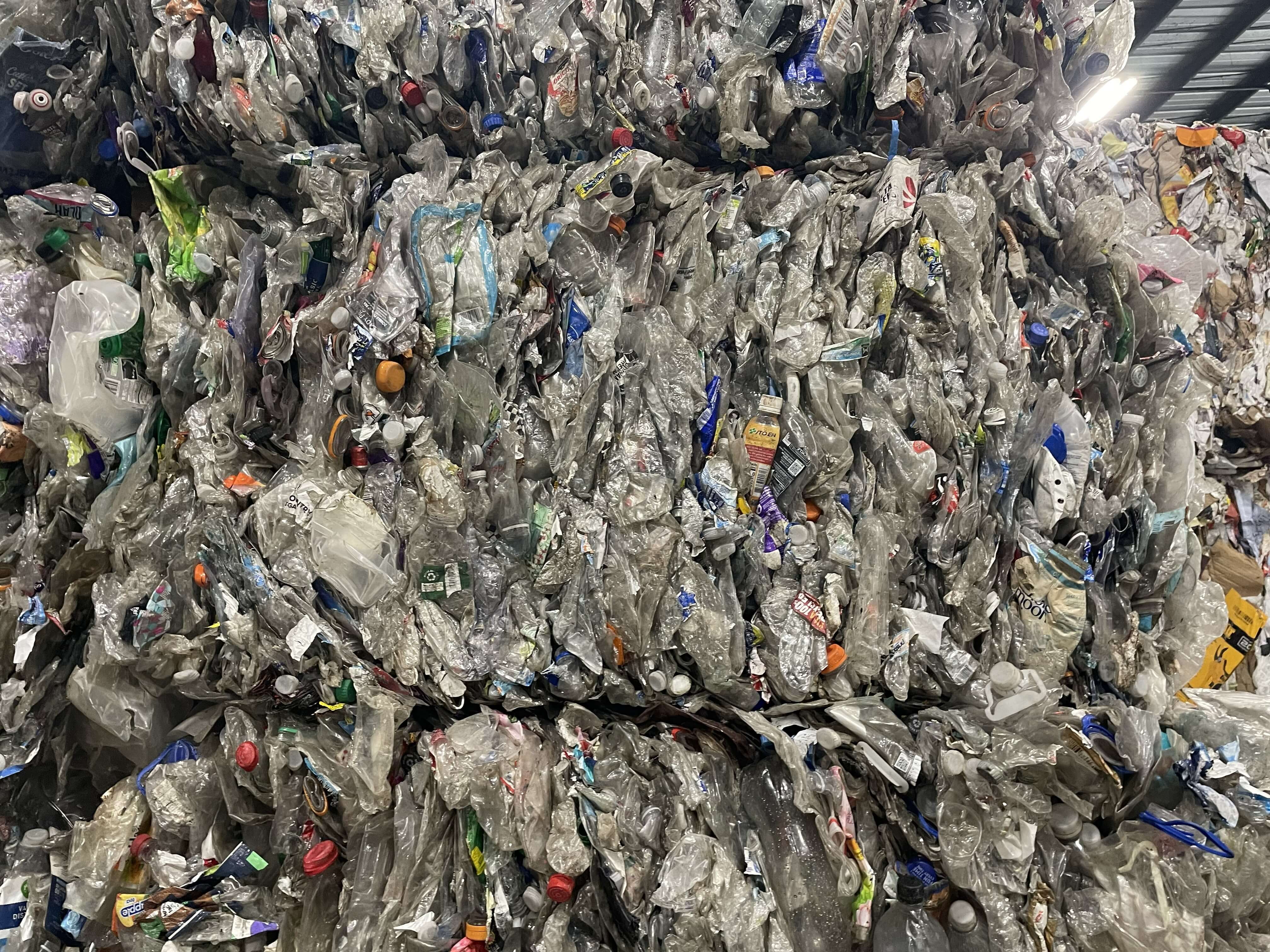 Close-up of post-consumer PET bottle bale showing material quality, recycled plastic for fiber and rPET resin