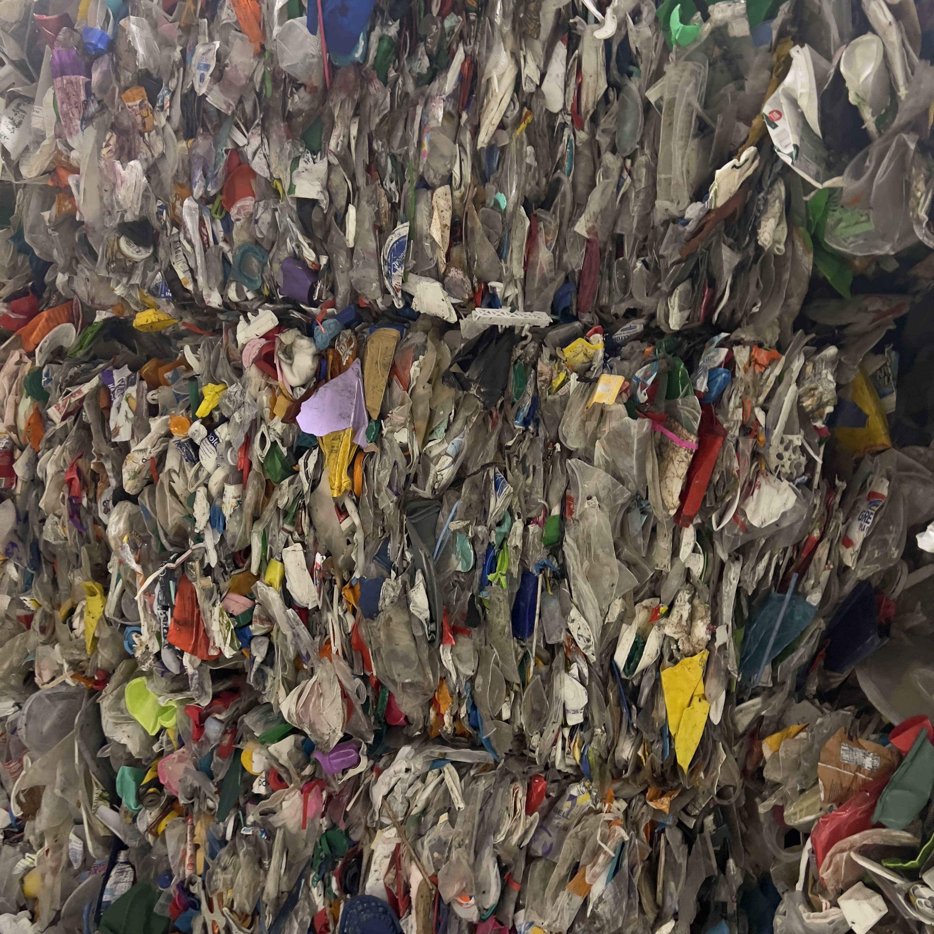 Mixed-color PP bale detail showing recycled polypropylene scrap for compounding and injection molding
